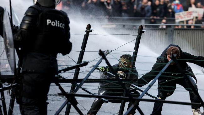 Police use water canon to disperse a demonstration over Covid-19 measures in Brussels, Belgium, over the weekend. Picture: AFP