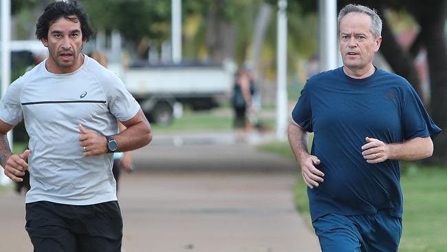 Bill Shorten with Jonathan Thurston during a morning run in Townsville. Picture: Kym Smith.