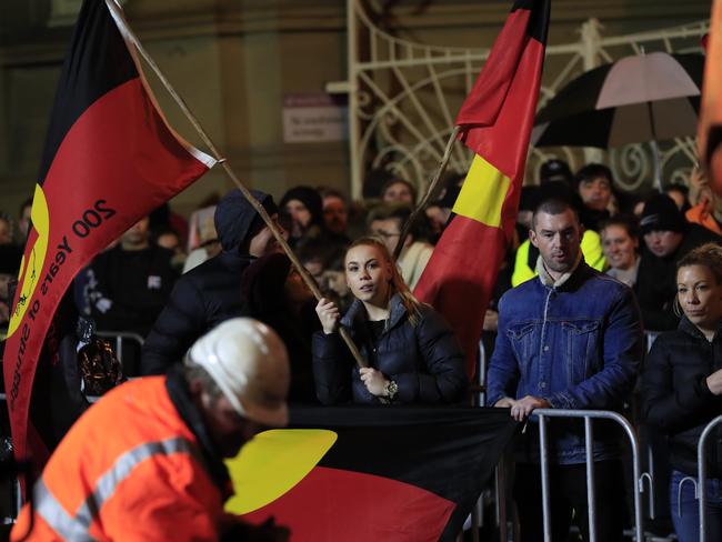 Aboriginal flags were waved while workers released artist Mike Parr. Picture: AAP/ROB BLAKERS