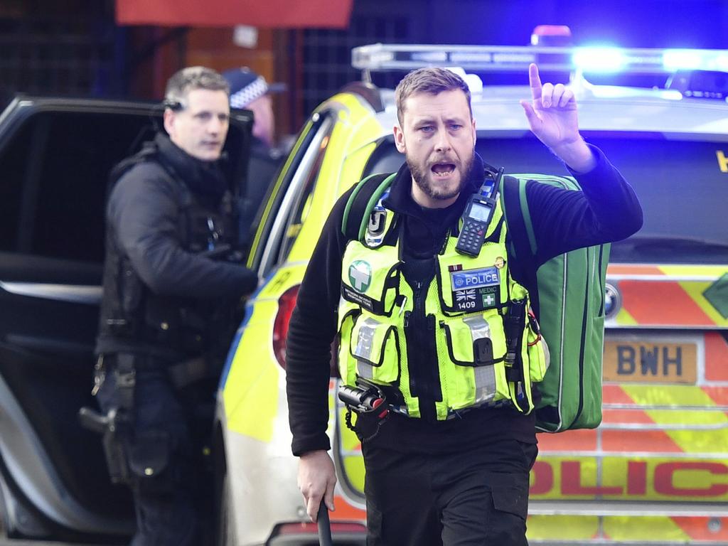 Police and emergency services at the scene of an incident on London Bridge. Picture: Dominic Lipinski/PA via AP.