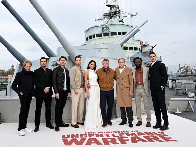 Producer Jerry Bruckheimer, Alex Pettyfer, Henry Golding, Henry Cavill, Eiza Gonzalez, Director Guy Ritchie, Cary Elwes, Babs Olusanmokun and Hero Fiennes Tiffin at HMS Belfast in March in London. Picture: Kate Green/Getty Images