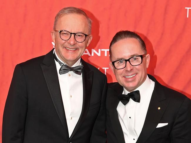 SYDNEY, AUSTRALIA - MARCH 31: Australian Prime Minister Anthony Albanese (L) stands with Qantas CEO Alan Joyce as they attend the Qantas 100th Gala Dinner at Jetbase 96 hangar at Sydney's International Airport on March 31, 2023 in Sydney, Australia. (Photo by James D. Morgan/Getty Images)