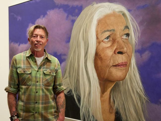 ANZ People's Choice award 2024 winner Angus McDonald with his portrait Professor Marcia Langton AO, oil on canvas, 154.5 x 271.5 cm © the artist, image © Art Gallery of New South Wales, Jenni CarterThese images may only be used in conjunction with editorial coverage of the Archibald Prize 2024 exhibition, 8 June  8 September 2024, at the Art Gallery of New South Wales, and strictly in accordance with the terms of access to these images  see artgallery.nsw.gov.au/info/access-to-agnsw-media-room-tcs. Without limiting those terms, these images must not be cropped or overwritten; prior approval in writing is required for use as a cover; caption details must accompany reproductions of the images; and archiving is not permitted. Media contact: media@ag.nsw.gov.au