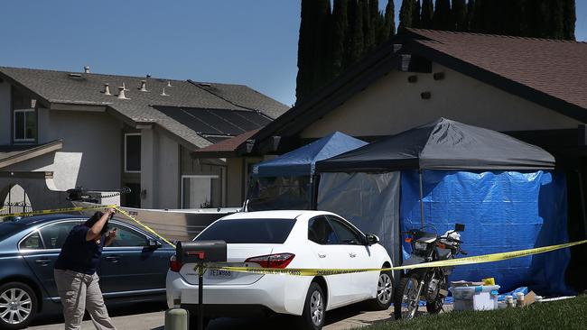 An FBI investigator enters the home of accused rapist and killer Joseph James DeAngelo on April 24, 2018 in Citrus Heights, California.