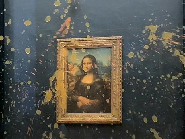 Leonardo Da Vinci's Mona Lisa (La Joconde) painting doused in soup by two environmental activists. Picture: AFP