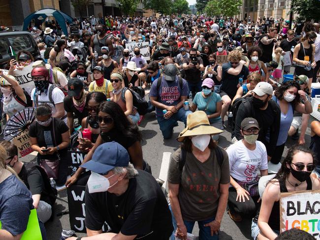 Protesters kneel near the White House in Washington, DC. Picture: AFP