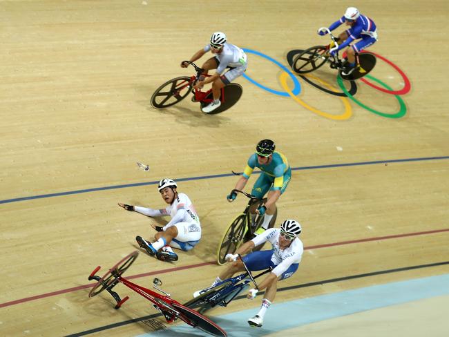 Elia Viviani of Italy, Glenn O’Shea of Australia and Sanghoon Park of Korea crash during the Cycling Track Men’s Omnium Points Race 6\\6 on Day 10 of the Rio 2016 Olympic Games at the Rio Olympic Velodrome on August 15, 2016 in Rio de Janeiro, Brazil. (Photo by Bryn Lennon/Getty Images)