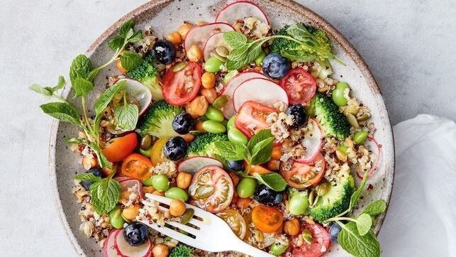 A healthy salad packed with fruit and vegetables.