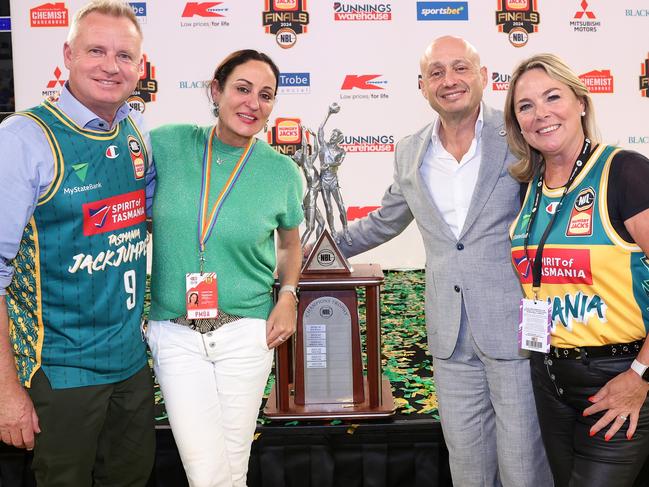 (L-R) Jeremy Rockliff, Premier of Tasmania, Christine Finnegan Co-Chief Executive Officer, Larry Kestelman, NBL Owner pose for a photo after the JackJumpers won the NBL championship last year. (Photo by Kelly Defina/Getty Images)