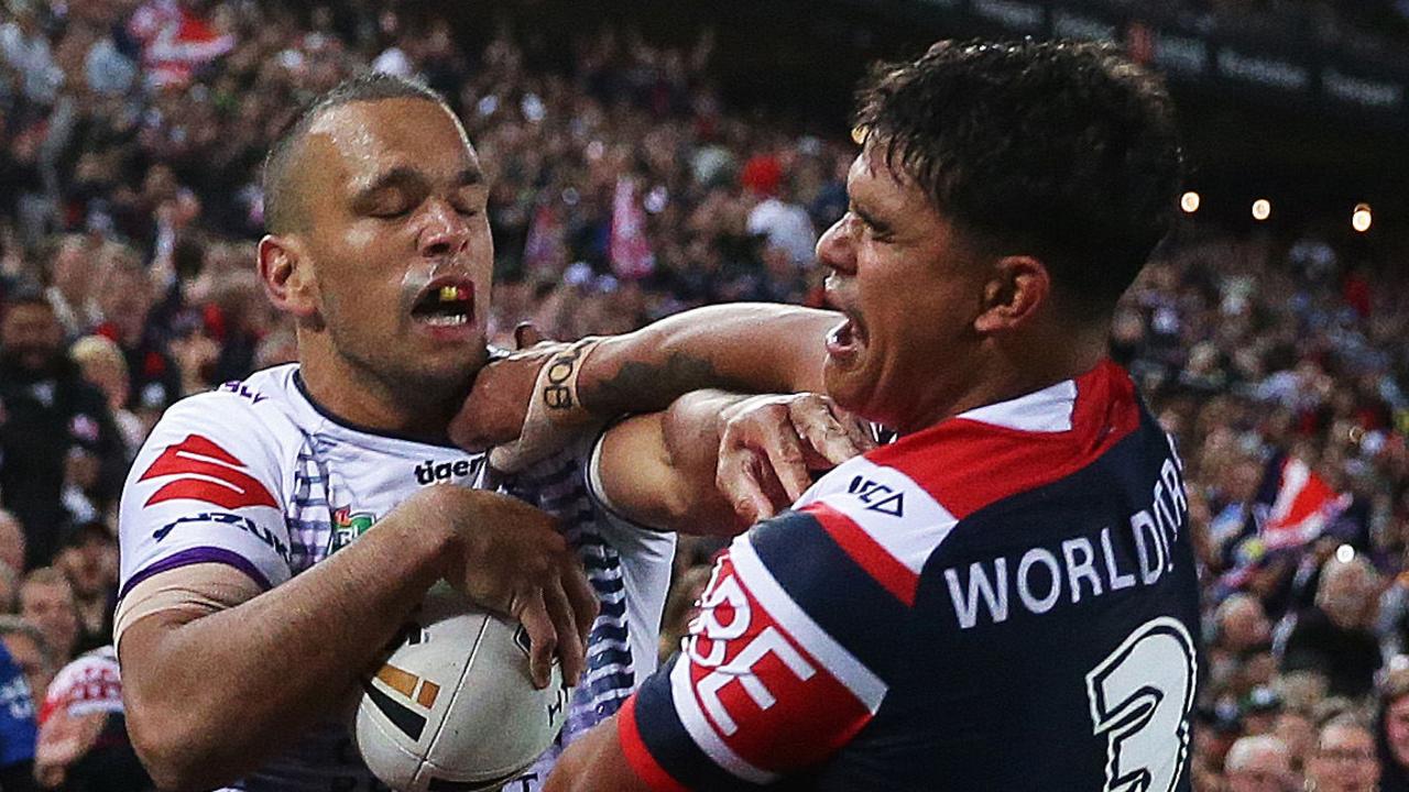 Melbourne's Will Chambers and Roosters’ Latrell Mitchell have a scrap during the 2018 grand final.