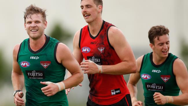 Essendon star Michael Hurley, left, is only in 11 per cent of SuperCoach teams.