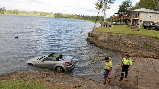 A Mercedes is pulled from the Burnett River at Sandy Hook. Picture: Mikayla Haupt