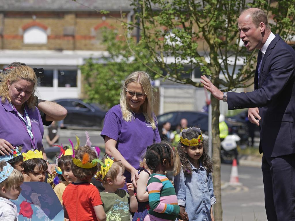 William greets staff members and their children as he arrives at the Oak Cancer Centre. Picture: Getty Images