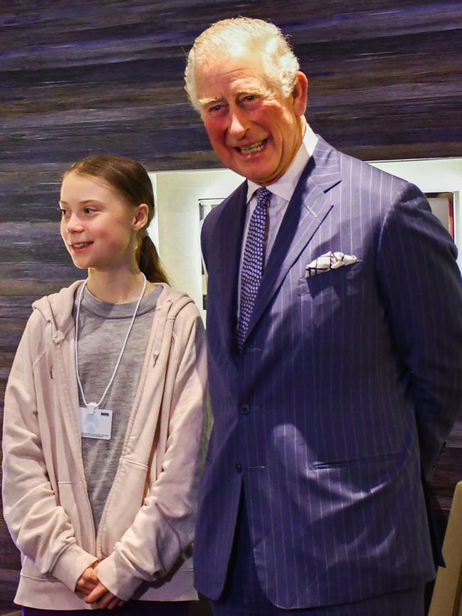 In a photo made available by Clarence House, Britain's Prince Charles poses with climate activist Greta Thunberg. Picture: AP