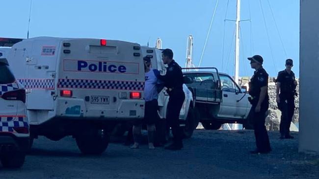 Police arrest a man at Mackay Harbour who is wanted over a Maryborough murder. Picture: Melanie Whiting