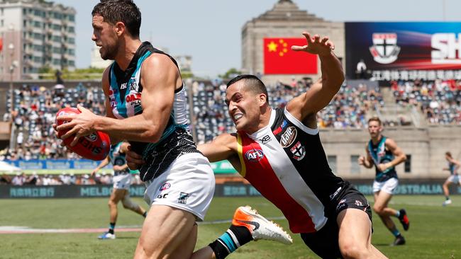 Travis Boak of the Power and Shane Savage of the Saints during last year’s Shanghai game. Picture: AFL Photos