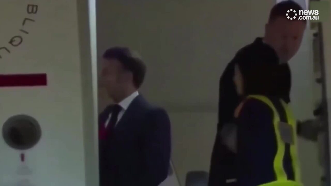 Wild moment French First Lady shoves President’s face