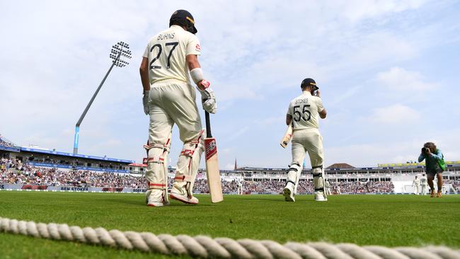 Rory Burns and Ben Stokes walk out to bat on day three. Picture: Getty Images