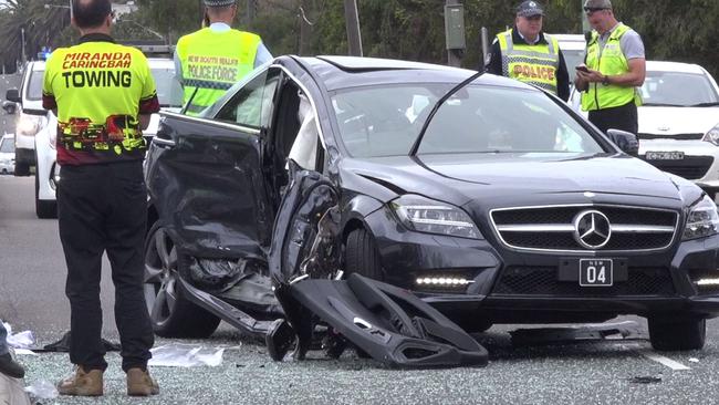 Police inspect the wreck of Mrs Vieira’s Mercedes after the collision earlier this month. Picture: TNV