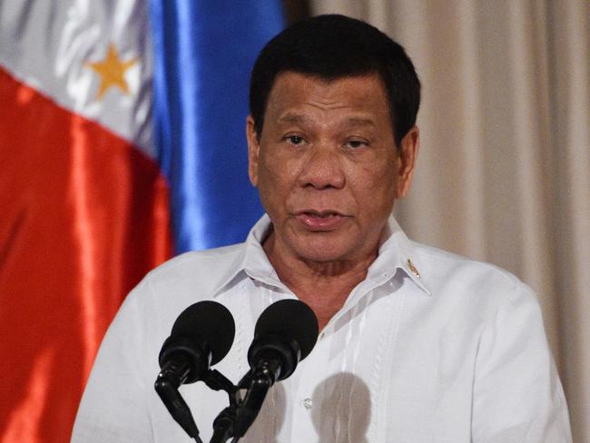 (FILES) Philippine President Rodrigo Duterte delivers his speech during the presentation ceremony of the signed document on the Organic Law for Bangsamoro Autonomous Region of Muslim Mindanao to officials of the Moro Islamic Liberation Front (MILF) at Malacanang palace in Manila on August 6, 2018. Former Philippines president Rodrigo Duterte was arrested on March 11, 2025 after landing at Manila's international airport by police acting on an International Criminal Court warrant over his deadly war on drugs, the presidential palace said. (Photo by TED ALJIBE / AFP)