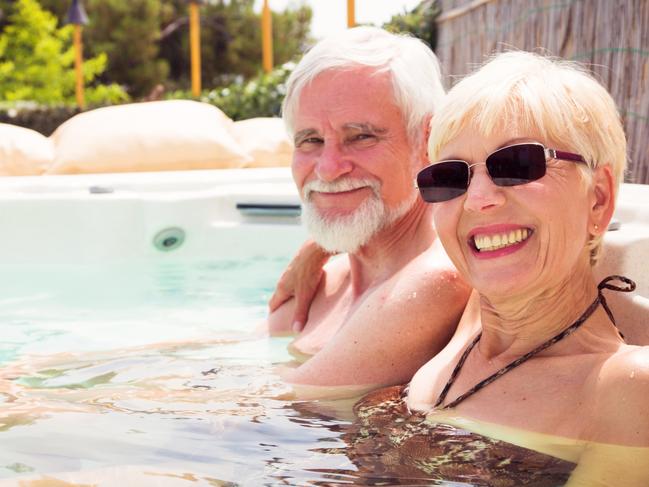 senior couple having a good time at the pool.  Retirees retirement generic.