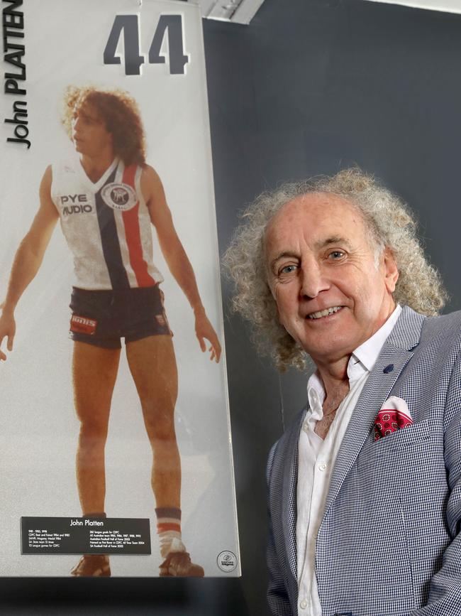 John Platten alongside his Magarey Medal banner at Elizabeth Oval. Picture: Dean Martin