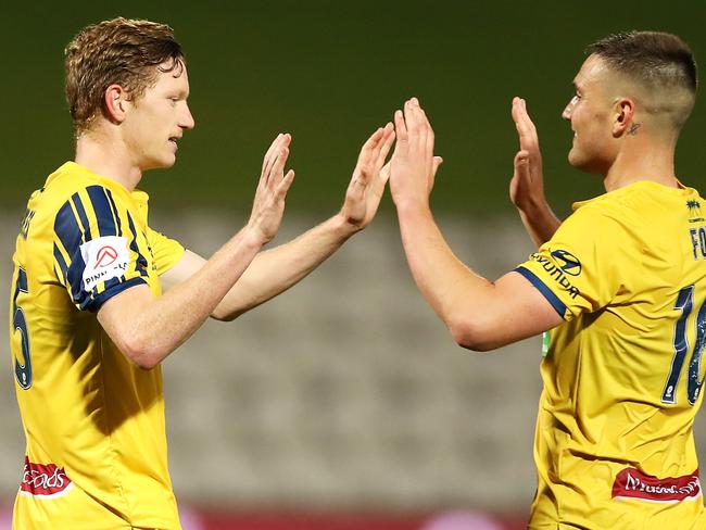 Mariners players Kye Rowles and Dylan Fox celebrate victory during the round 26 A-League against Melbourne last night at Netstrata Jubilee Stadium. (Photo by Mark Kolbe/Getty Images)