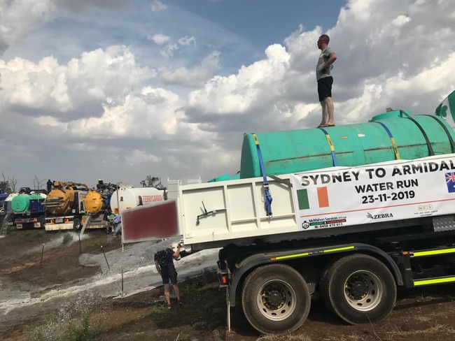 A group of Irish construction workers carting truckloads of water from Sydney to Armidale. Picture: RFS