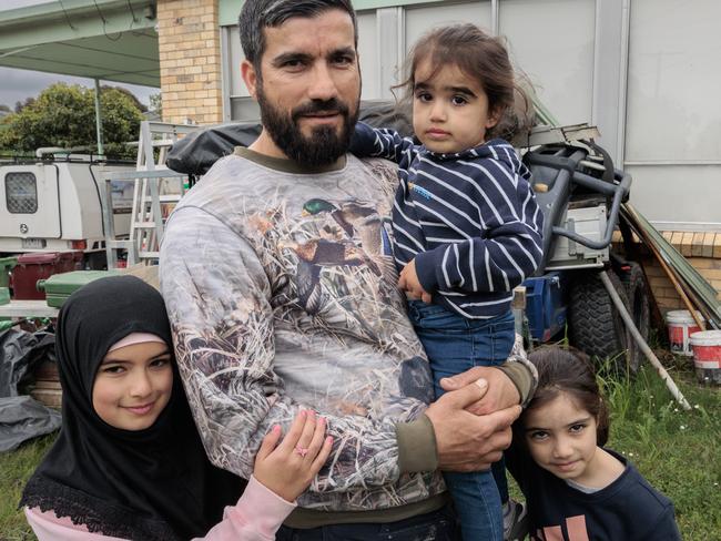 23/10/2022 Muhammad Dabdab with his daughters, Mayam, 9, Hiba, 2, and Iman, 6, outside their home in Broadmeadows. They are a low income family in the Broadmeadows area  talking about what they want to see in the upcoming Federal Budget.Picture: David Geraghty