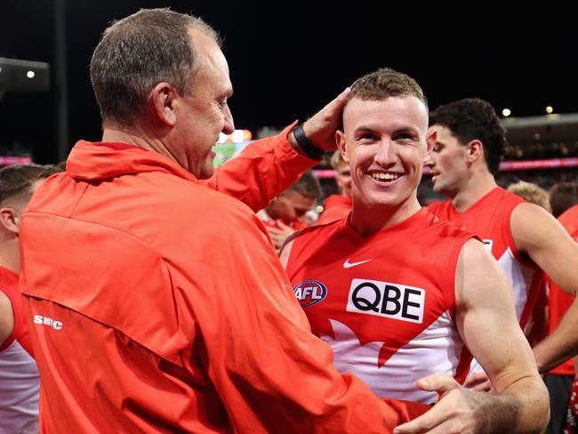 SYDNEY, AUSTRALIA - SEPTEMBER 20: John Longmire, Senior Coach of the Swans and Chad Warner of the Swans celebrate after winning the AFL Preliminary Final match between Sydney Swans and Port Adelaide Power at Sydney Cricket Ground, on September 20, 2024, in Sydney, Australia. (Photo by Cameron Spencer/Getty Images)