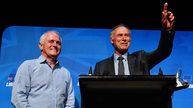 Prime Minister Malcolm Turnbull (left) and newly elected Liberal member for Bennelong John Alexander celebrate. Picture: AAP