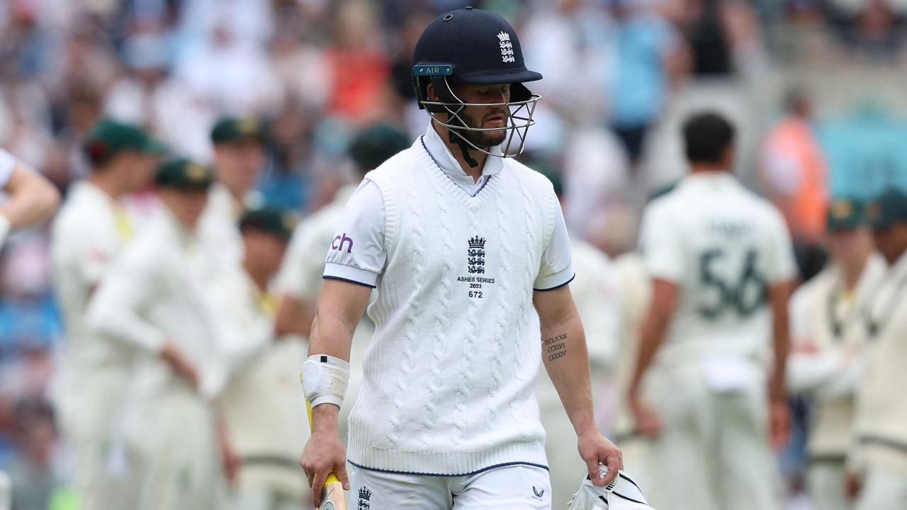 Ben Duckett walks back to the pavilion. (Photo by Adrian DENNIS / AFP) /