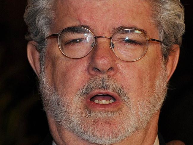 Director George Lucas (R) and partner arrive on the red carpet for the 2010 Oscars Governors Ball at the Hollywood and Highland Center in Hollywood on November 13, 2010. AFP PHOTO/Mark RALSTON