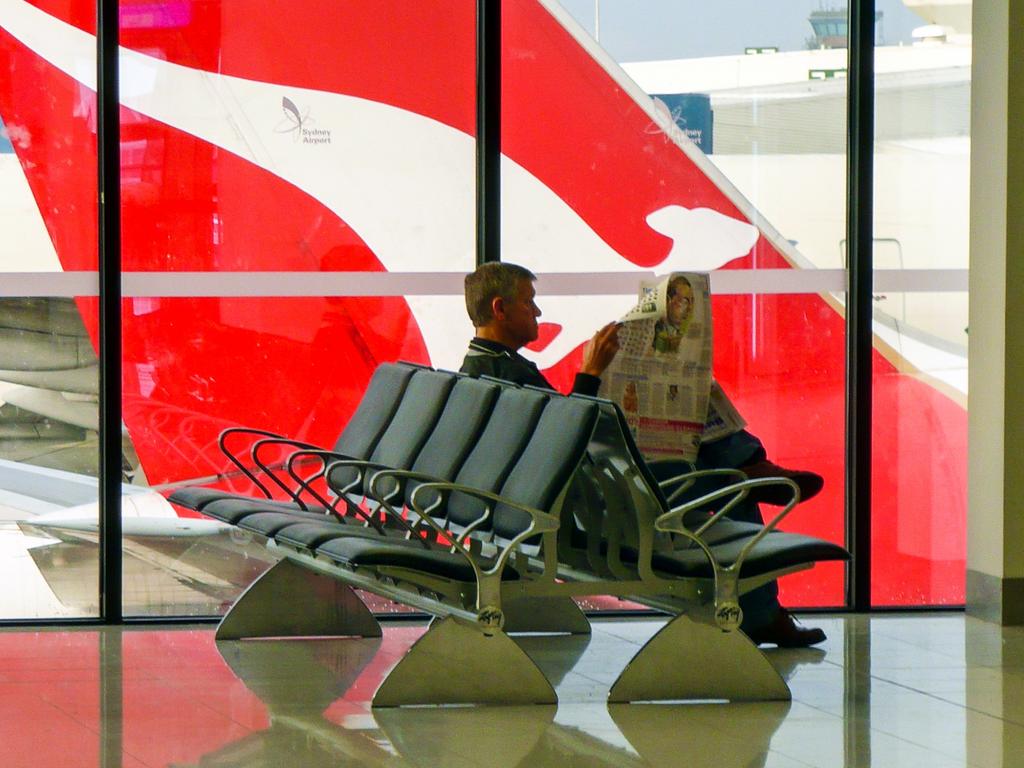 Botany Bay, Australia - June 21, 2009: The tailplane of a Qantas plane is viewed through the window of the departure lounge at Kingsford Smith Airport in Sydney. For: Where, why and when in 2020. Credit: Istock