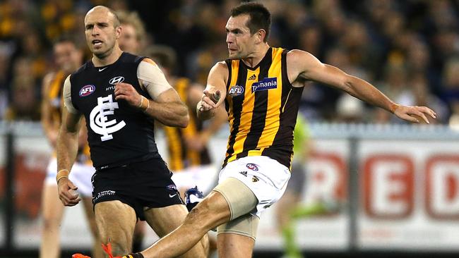 Luke Hodge and Chris Judd in action. Picture: Wayne Ludbey