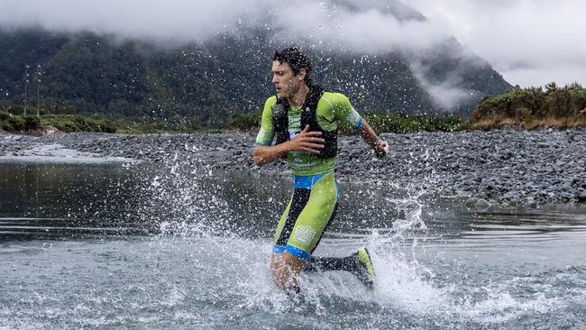 Tasmanian Alex Hunt at the first river crossing of the mountain run in the gruelling 243km Kathmandu Coast to Coast in New Zealand. Picture: Iain McGregor/Coast to Coast