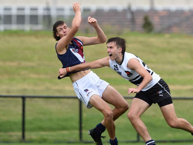 Blake Howes, left, contests the ball. Picture: Steve Tanner