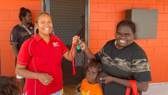 Remote Housing and Homelands Minister and Member for Arnhem Selena Uibo with residents of new homes in Beswick. Picture: Supplied