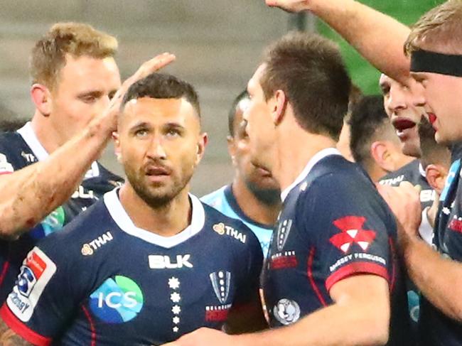 MELBOURNE, AUSTRALIA - MAY 31: Quade Cooper of the Rebels is congratulated by his teammates after scoring a try during the round 16 Super Rugby match between the Rebels and the Waratahs at AAMI Park on May 31, 2019 in Melbourne, Australia. (Photo by Scott Barbour/Getty Images)