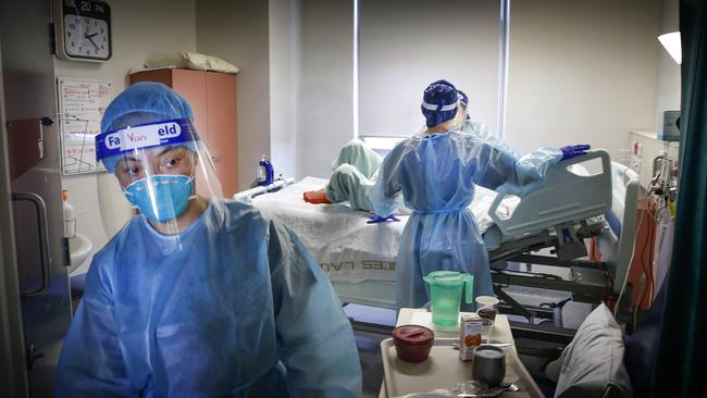 Nurses at work in Royal Melbourne Hospital’s ICU and Covid wards. Picture: David Caird