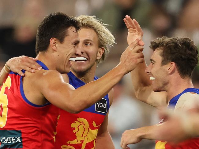 Hugh McCluggage celebrates with teammates after kicking a goal against the Dees. Picture: Robert Cianflone/Getty Images.