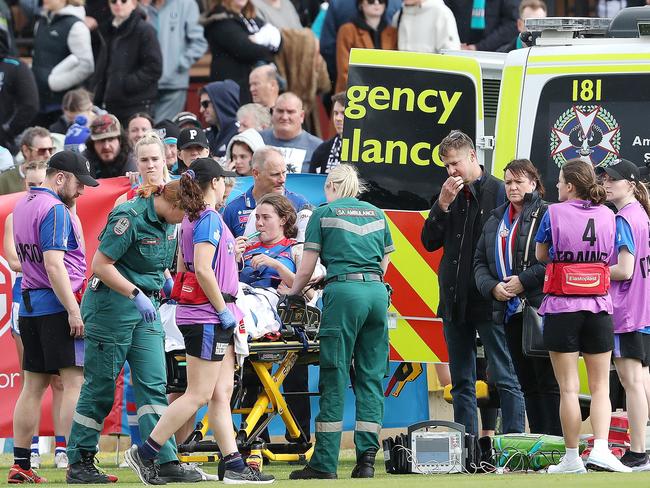 Bulldog Britney Gutknecht in the hands of trainers after breaking her leg during the Round 2 game against Port Adelaide. Picture: Getty Images