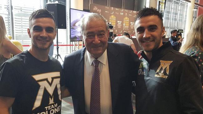 Boxing twins Jason and Andrew Moloney with promoter Bob Arum.