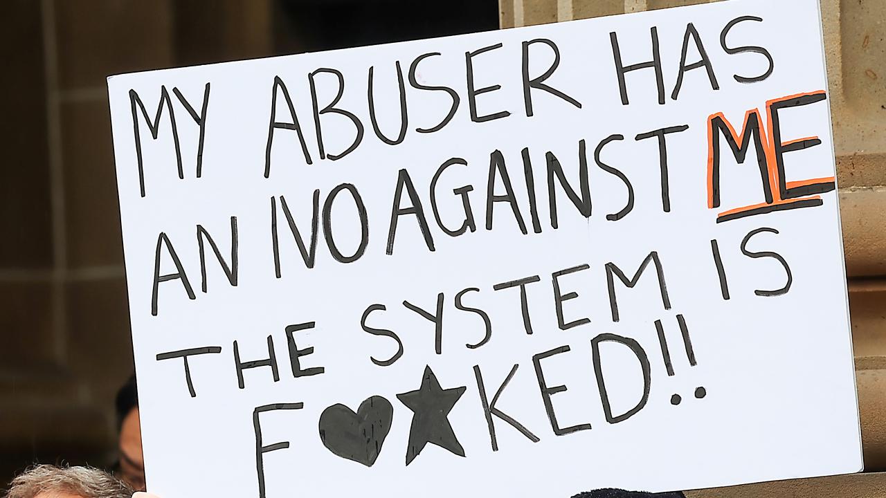 A woman holds a sign during the Melbourne rally on Saturday. Picture: NewsWire/Ian Currie.