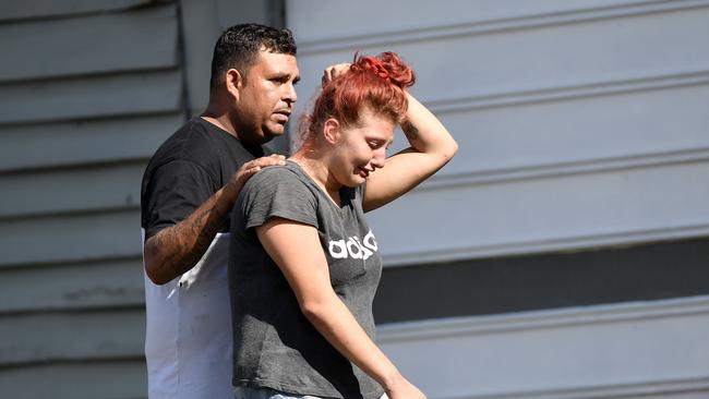 A man and woman at the scene of a police shooting in Ipswich. Picture: Patrick Woods.