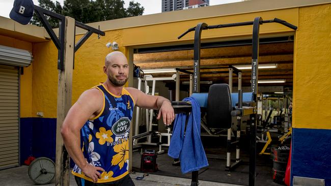 Gold Coast Eagles rugby club have found a loophole in COVID-19 restrictions to get a leg up on competition. They've taken their club gym outside and set up a roster to keep them fit + monitor mental health. Aaron Grant in the outside gym. Picture: Jerad Williams