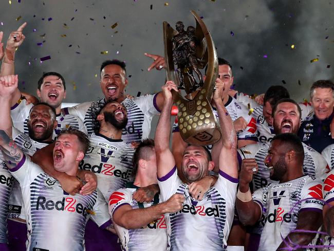 SYDNEY, AUSTRALIA - OCTOBER 25: Cameron Smith of the Storm holds aloft the Premiership trophy and celebrates with team mates after winning the 2020 NRL Grand Final match between the Penrith Panthers and the Melbourne Storm at ANZ Stadium on October 25, 2020 in Sydney, Australia. (Photo by Cameron Spencer/Getty Images)