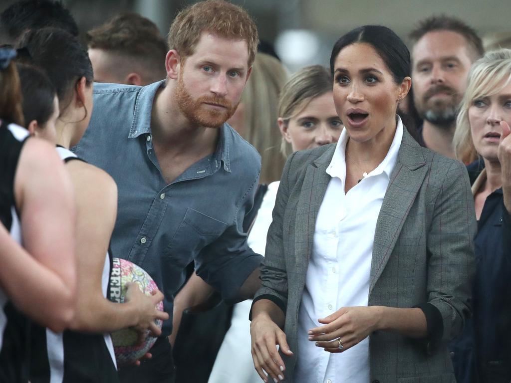 The Duke and Duchess of Sussex look out towards the heavy rain and storm as they visit the Clontarf Foundation and Girls Academy at Dubbo College on October 17, 2018. Picture: Cameron Spencer/Getty Images.