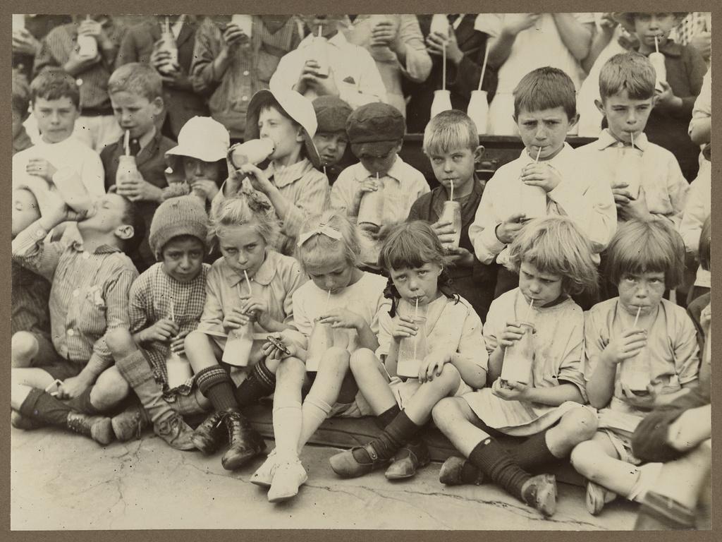 School children drink AMSCOL milk, circa 1928. B54765-1-27 / State Library SA