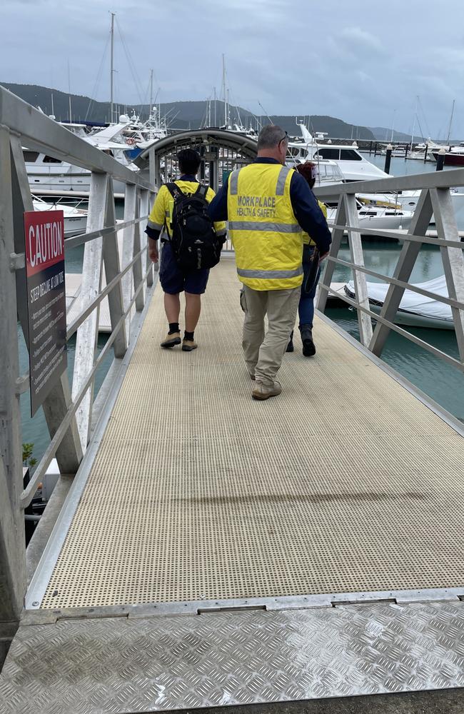 Workplace Health and Safety inspectors are on scene where a man suffered serious facial injuries after an boat explosion at Coral Sea Marina. Picture: Estelle Sanchez